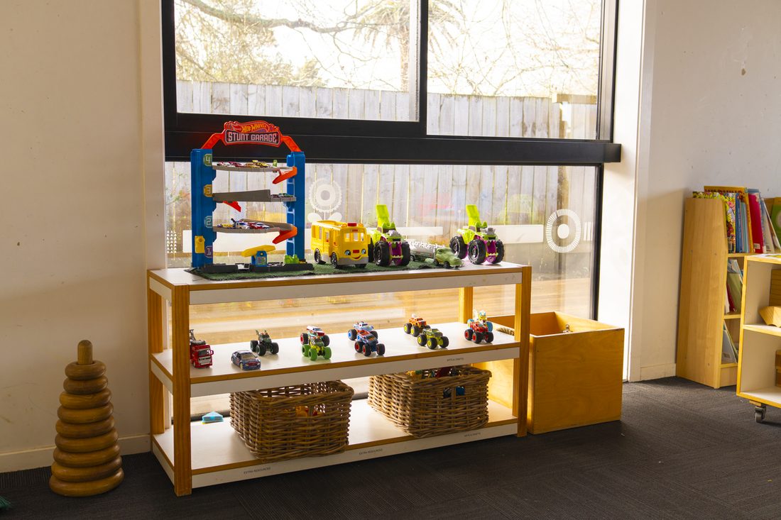 Low shelves with manipulative toys and games in the Morepork room